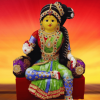 Varamahalakshmi Idol With Ornaments in Green And Red Saree