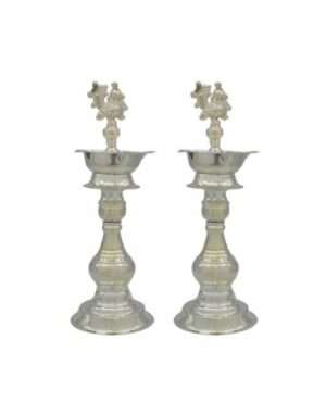 The German Silver Diya Stand with Peacock Design is the perfect piece to add to your pooja room. These large lamps with intricate designs with a touch of silver would intensify your festive decorations, especially on the pure Diwali or Lakshmi puja celebrations. You can also place this big Deepak stand in your office prayer hall. Get this best quality silver lamp at the best affordable price with Puja N Pujari in India available online. Key Features- Excellent silver quality Diya stand for your pooja room. Intricate designs all over the product. Available at a reasonable price at Puja N Pujari. Product Details- Product Contain A pair of Diya Stand German Silver Large - Peacock Design Color: Silver Material: German Silver Size: LxWxH = (11x11x28)cm Shipping info: Delivery in a maximum of 5-7 working days. We will allow cancellation within 24 hours of placing the order.