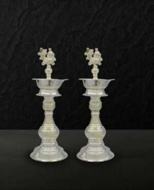 The German Silver Diya Stand with Peacock Design is the perfect piece to add to your pooja room. These large lamps with intricate designs with a touch of silver would intensify your festive decorations, especially on the pure Diwali or Lakshmi puja celebrations. You can also place this big Deepak stand in your office prayer hall. Get this best quality silver lamp at the best affordable price with Puja N Pujari in India available online. Key Features- Excellent silver quality Diya stand for your pooja room. Intricate designs all over the product. Available at a reasonable price at Puja N Pujari. Product Details- Product Contain A pair of Diya Stand German Silver Large - Peacock Design Color: Silver Material: German Silver Size: LxWxH = (11x11x28)cm Shipping info: Delivery in a maximum of 5-7 working days. We will allow cancellation within 24 hours of placing the order.